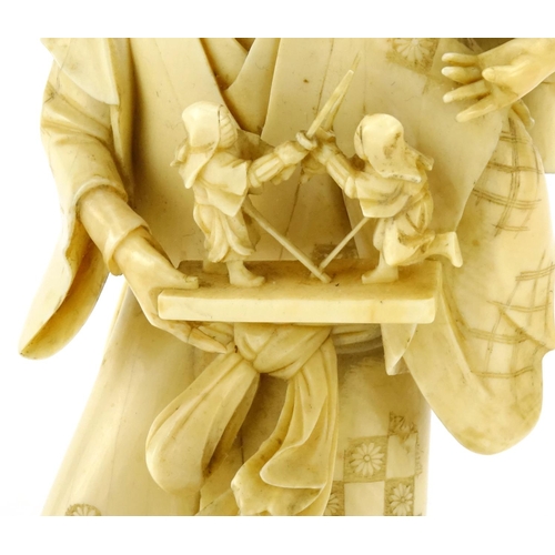 348 - Good Japanese Meiji period carved ivory okimono of a father and child, the father holding a diorama ... 