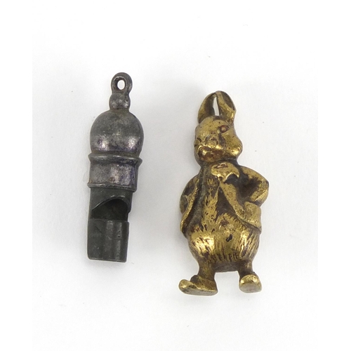 471 - Miniature bronzed metal figure of Peter Rabbit and a silver coloured metal whistle, the largest 3.5c... 