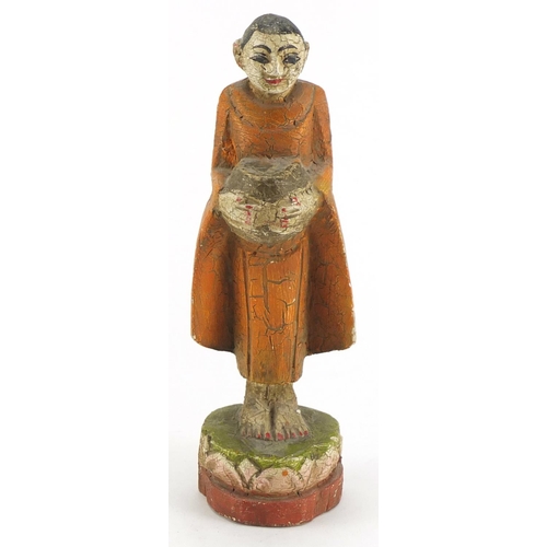 130 - Asian polychrome hand painted carved wooden figure, 25cm high