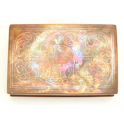 590 - Indian copper cigarette box with hinged lid and silver inlay, 15cm wide