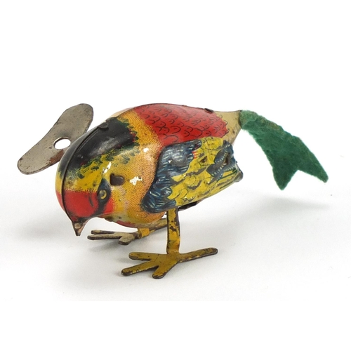 424 - Tin plate clockwork bird, 8cm in length