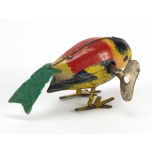 424 - Tin plate clockwork bird, 8cm in length