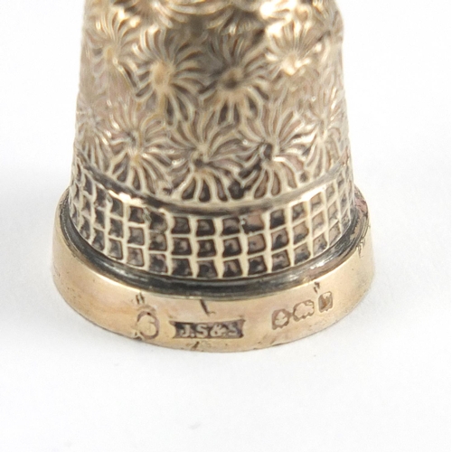 309 - Four silver thimbles two with floral decoration, the largest 2.1cm high, approximate weight 13.2g