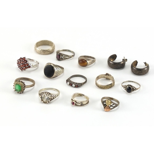 206 - Twelve silver and white metal rings and a pair of earrings, some set with colourful stones, approxim... 