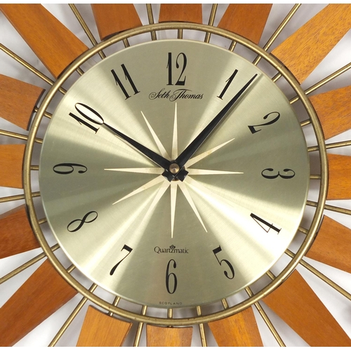 2106 - Seth Thomas teak and brass sunburst design clock, 67.5cm in diameter
