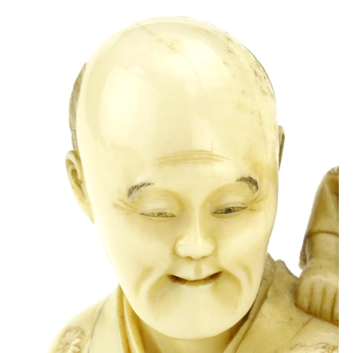 348 - Good Japanese Meiji period carved ivory okimono of a father and child, the father holding a diorama ... 