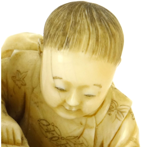 348 - Good Japanese Meiji period carved ivory okimono of a father and child, the father holding a diorama ... 