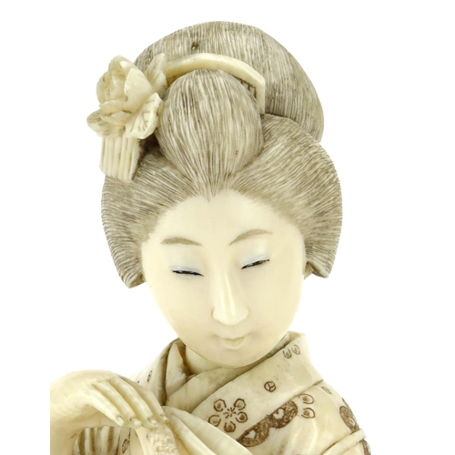 349 - Good Japanese Meiji period carved ivory okimono of a Geisha girl and three chickens, incised marks a... 