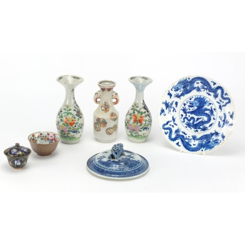 605 - Japanese and Chinese ceramics and a cloisonné box and cover, including a pair of vases and a blue an... 