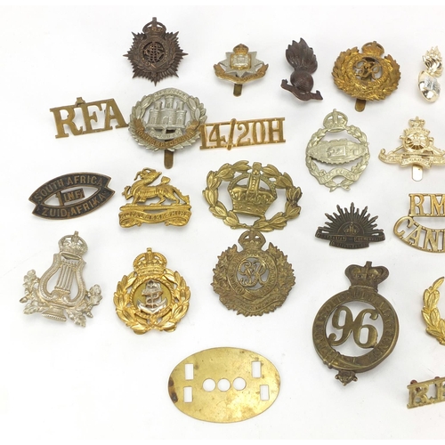 737 - Military interest cap badges including Northamptonshire and Royal Canadian Engineers