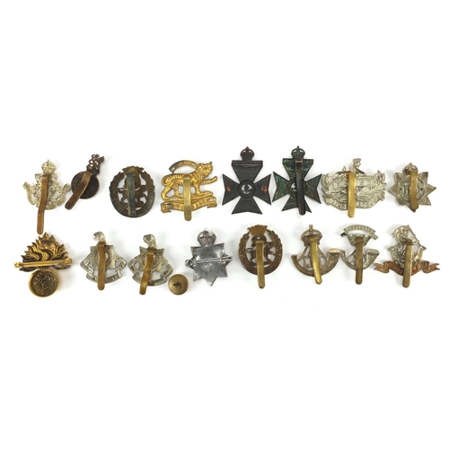 214 - British Military cap badges including Leicestershire Regiment, York and Lancaster Regiment and Royal... 