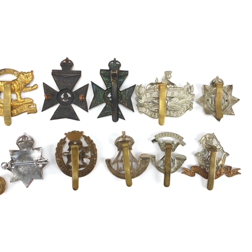 214 - British Military cap badges including Leicestershire Regiment, York and Lancaster Regiment and Royal... 