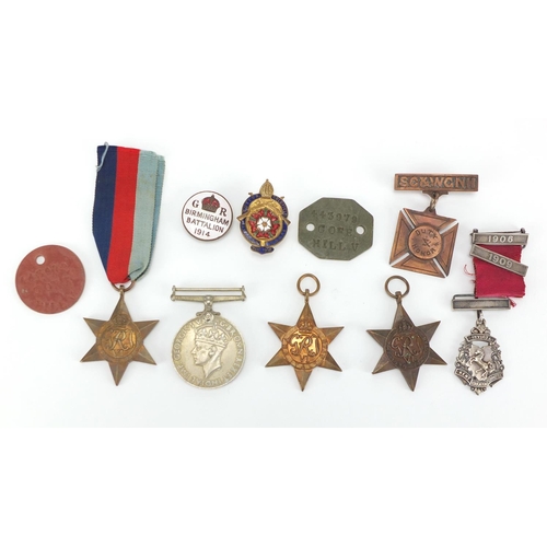 747 - Militaria and badges including Four British Military World War II medals