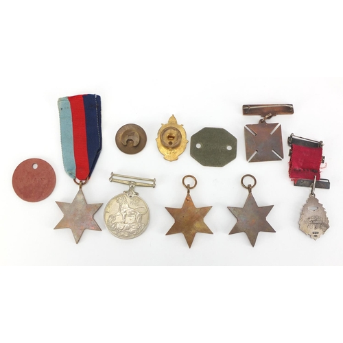 747 - Militaria and badges including Four British Military World War II medals
