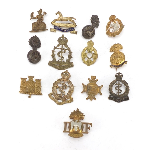 744 - Military interest cap badges including Royal Canadian Army Medical Corps and West Yorkshire