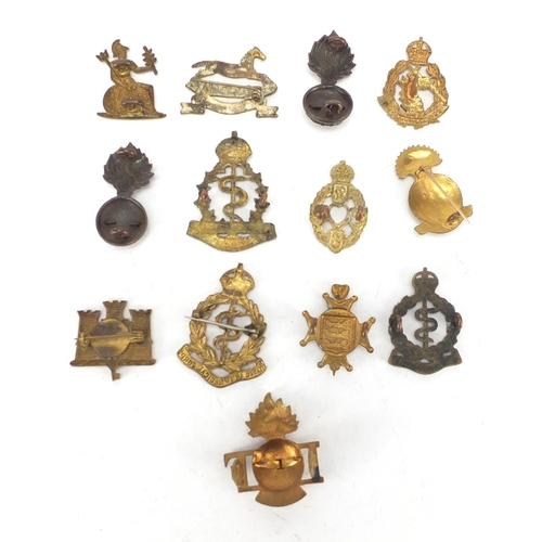 744 - Military interest cap badges including Royal Canadian Army Medical Corps and West Yorkshire