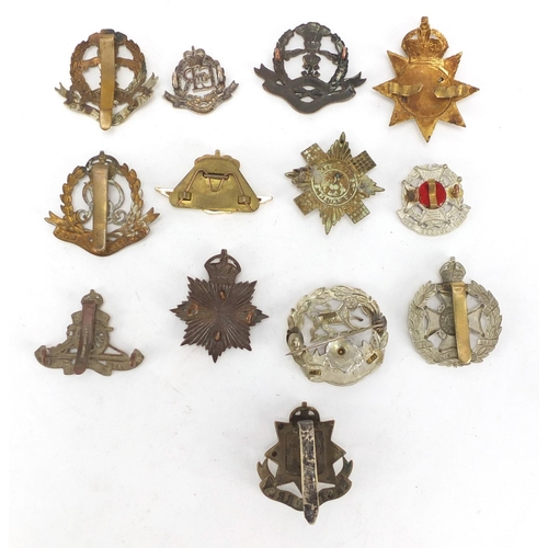 728 - Military interest cap badges including Military Police and East Surrey
