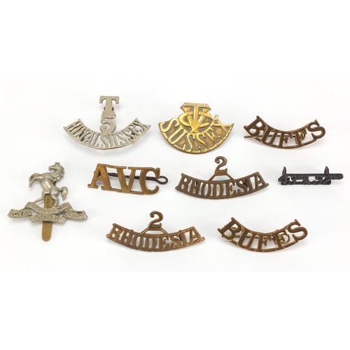 749 - Military interest cap badges including Royal Sussex and Rhodesia