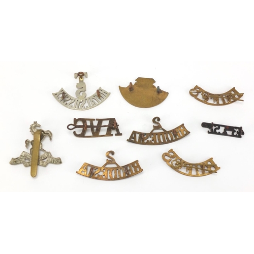 749 - Military interest cap badges including Royal Sussex and Rhodesia