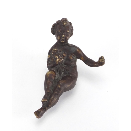 451 - Bronzed figure of a seated child, 8cm in length