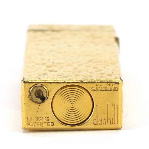 2528 - Dunhill gold plated bark design pocket lighter, 6.5cm high