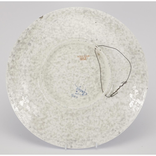 528 - Crown Ducal pottery wall plaque by Charlotte Rhead, hand painted and tube lined with stylised flower... 