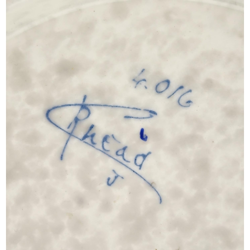 528 - Crown Ducal pottery wall plaque by Charlotte Rhead, hand painted and tube lined with stylised flower... 