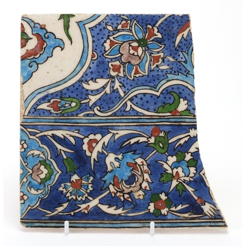410 - Iznik pottery tile fragment, hand painted with stylised flowers, 20cm x 19cm