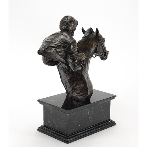 2222 - Patinated bronze bust of a jockey on horseback, raised on a rectangular black marble base, incised G... 