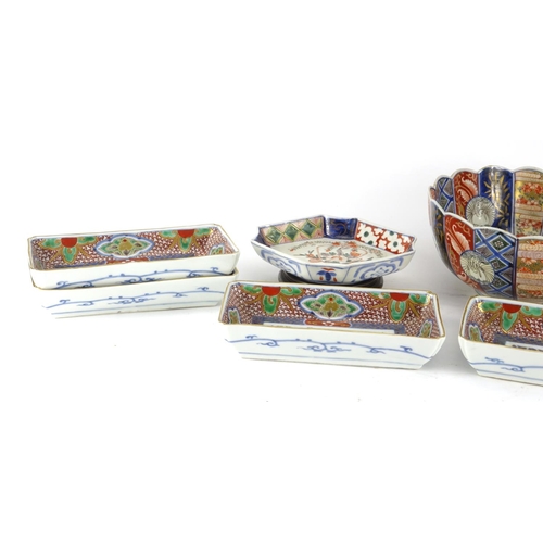 2383 - Japanese Imari porcelain including a fluted bowl and six rectangular dishes, the bowl hand painted w... 