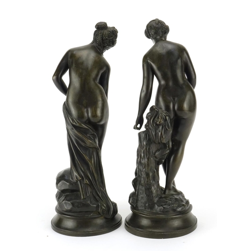 3 - Pair of patinated bronze figures of semi-clad maidens, the largest 34cm high