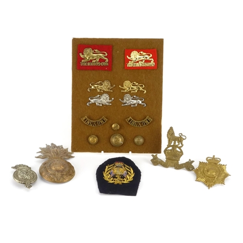 212 - British Militaria including Royal Marine helmet plate, The Kings own badges and pips