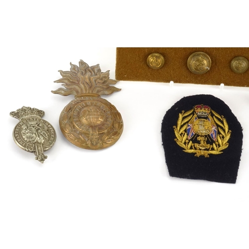 212 - British Militaria including Royal Marine helmet plate, The Kings own badges and pips