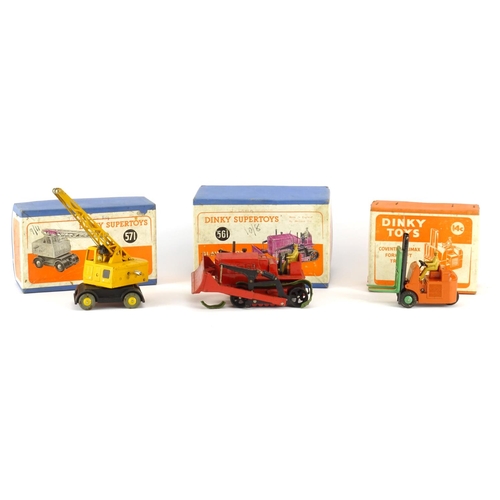 249 - Three Dinky die cast vehicles with boxes comprising forklift truck 14c, blaw knox bulldozer 561 and ... 