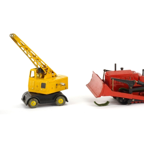 249 - Three Dinky die cast vehicles with boxes comprising forklift truck 14c, blaw knox bulldozer 561 and ... 