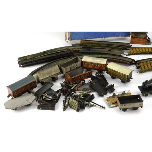 243 - German OO gauge tin plate electric model railway and accessories by Bing, including locomotives, car... 