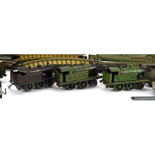 243 - German OO gauge tin plate electric model railway and accessories by Bing, including locomotives, car... 