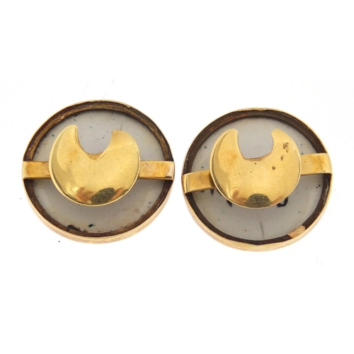 680A - Pair of unmarked gold and enamelled studs, depicting Chilton & Géneve, each 1.7cm in diameter, appro... 