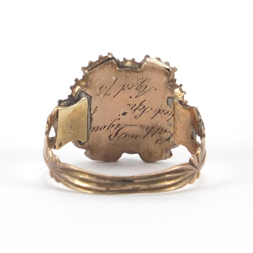 747 - Antique unmarked gold garnet and seed pearl mourning ring, with indistinct inscription to the unders... 