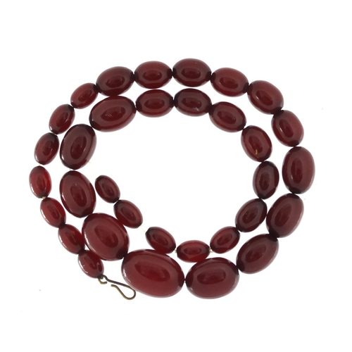 766A - Cherry amber coloured bead necklace, 45cm in length, approximate weight 31.4g