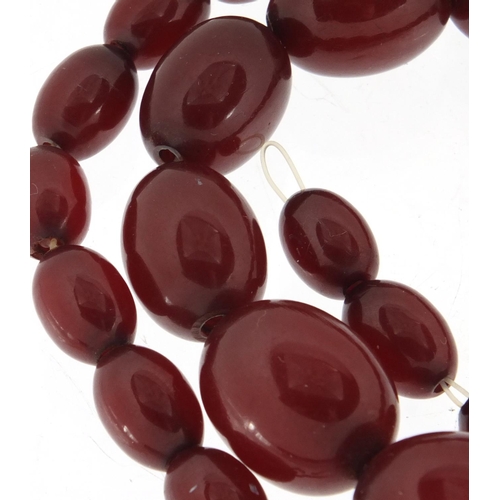 766A - Cherry amber coloured bead necklace, 45cm in length, approximate weight 31.4g