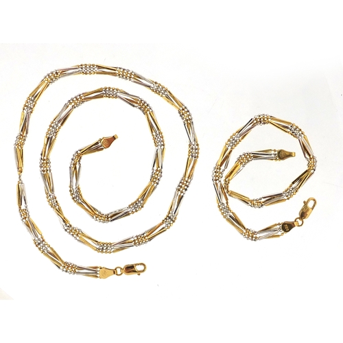 695 - 18ct two tone gold necklace and matching bracelet, the  necklace, 44cm in length, approximate weight... 