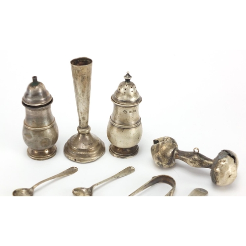 325 - Silver items including two baluster shaped casters, sugar tongs, Georgian teaspoon and a bud vase, v... 