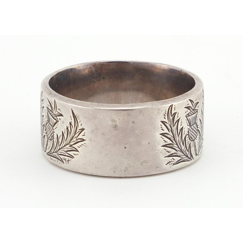 2594 - Circular silver napkin ring inlaid with hard stones and engraved with Scottish thistles, hallmarked ... 