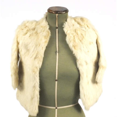 561 - Child's cream fur coat, hat and handbag