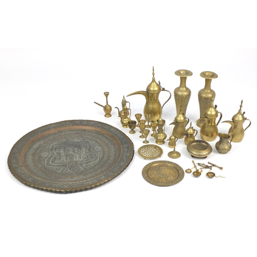 550 - Mostly Middle Eastern metalwares, including coffee pots and a pair of vases engraved with flowers an... 