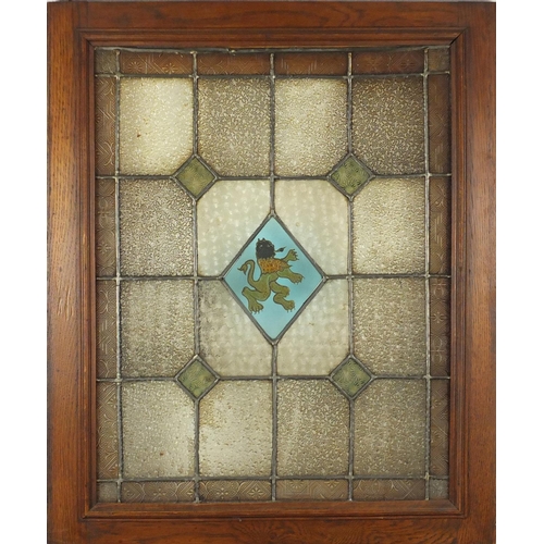 544 - Pair of Arts & Crafts stained glass windows housed in oak frames, each overall 69cm x 56.5cm