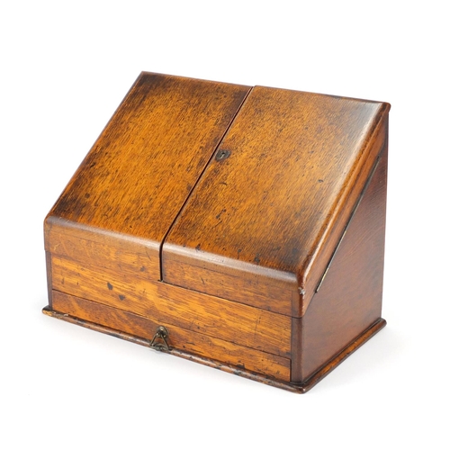 30 - Victorian oak slope front stationery box, with fitted interior and base drawer, 29cm H x 37.5cm W x ... 