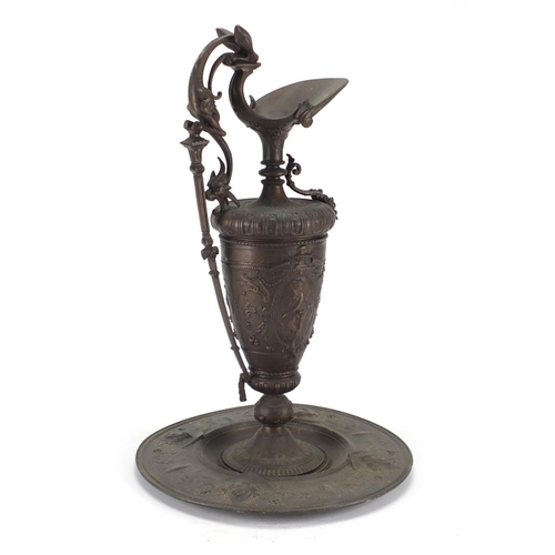 17 - 19th century cast iron Neoclassical design ewer on stand, cast with classical figures, urns and foli... 