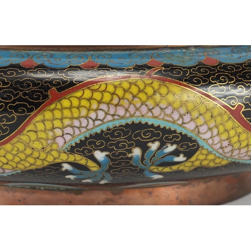 323 - Chinese cloisonné bowl enamelled with dragons amongst clouds, four figure character marks to the bas... 